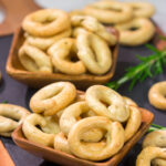 Lightly flavored with olive oil and chopped rosemary, Taralli are the perfect snack to serve alongside a good glass of wine!