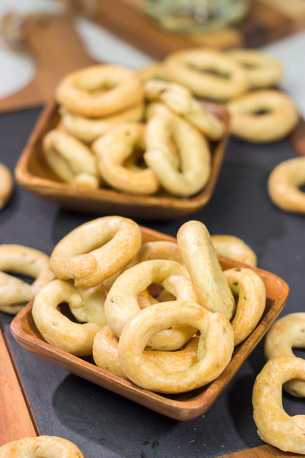 Lightly flavored with olive oil and chopped rosemary, Taralli are the perfect snack to serve alongside a good glass of wine!
