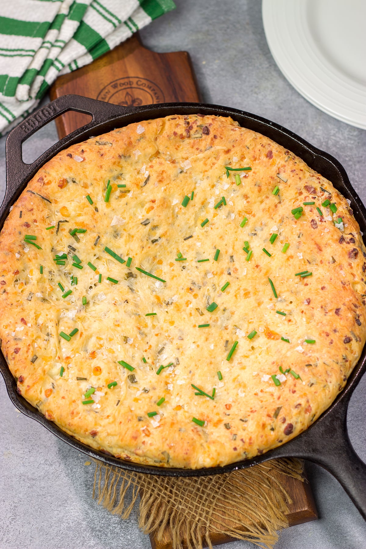 This Cheesy Chive Bread has incredible flavor! This skillet bread is a great side dish alongside a bowl of soup or chili.