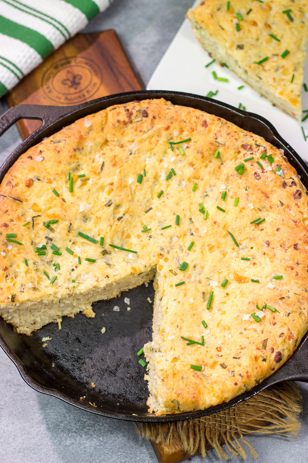This Cheesy Chive Bread has incredible flavor! This skillet bread is a great side dish alongside a bowl of soup or chili.