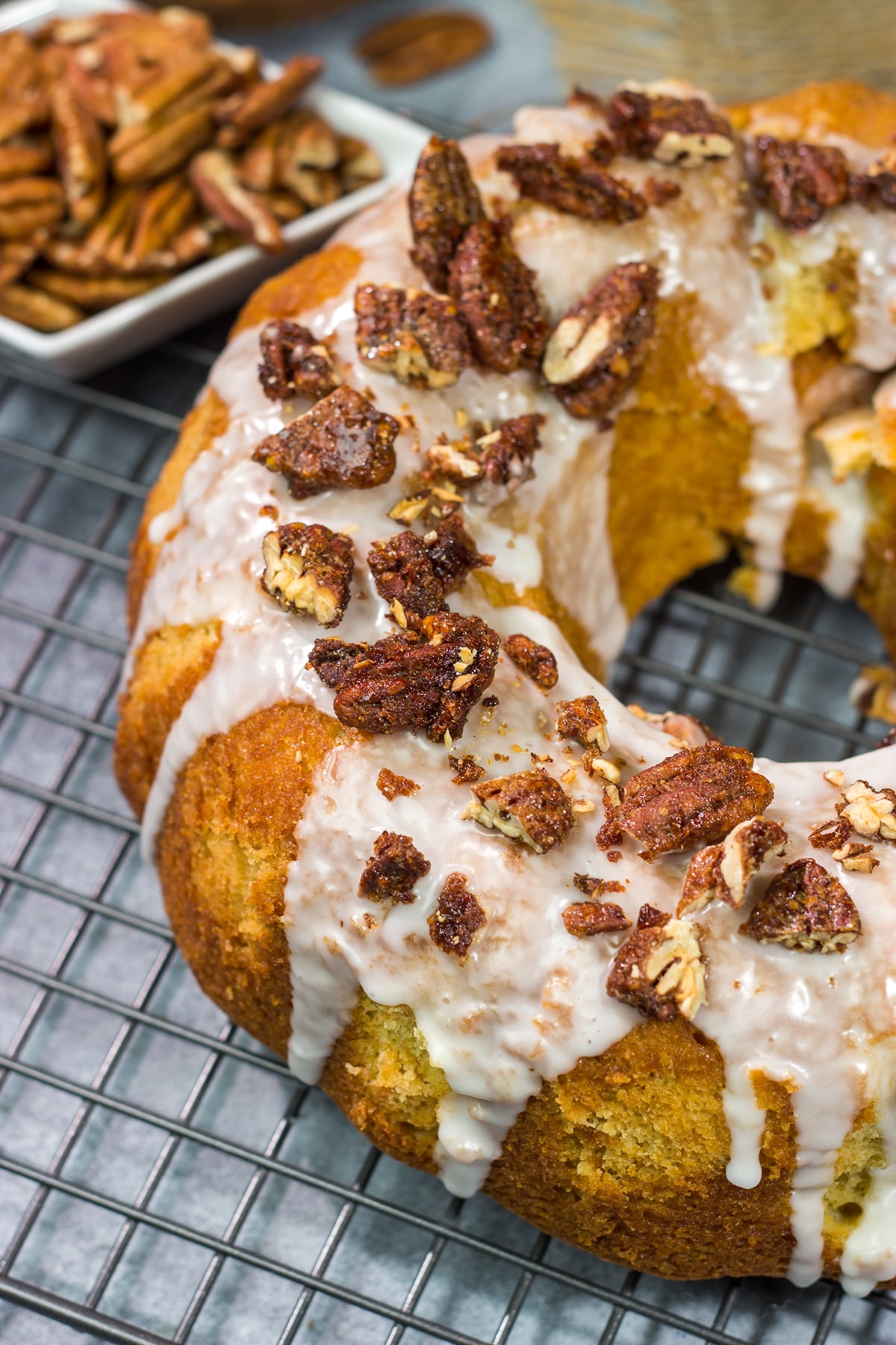 This Sweet Potato Pound Cake is a tender, buttery cake recipe that calls for cinnamon and mashed sweet potatoes. Topped with cinnamon pecans, this cake is the perfect fall dessert!