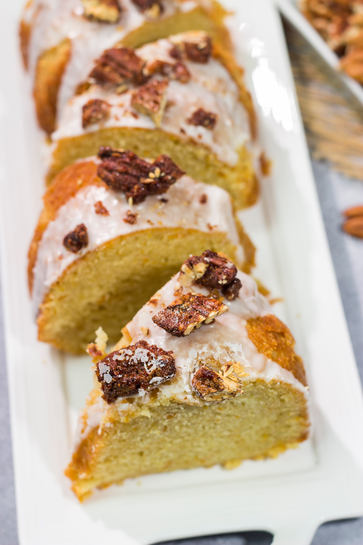 This Sweet Potato Pound Cake is a tender, buttery cake recipe that calls for cinnamon and mashed sweet potatoes. Topped with cinnamon pecans, this cake is the perfect fall dessert!