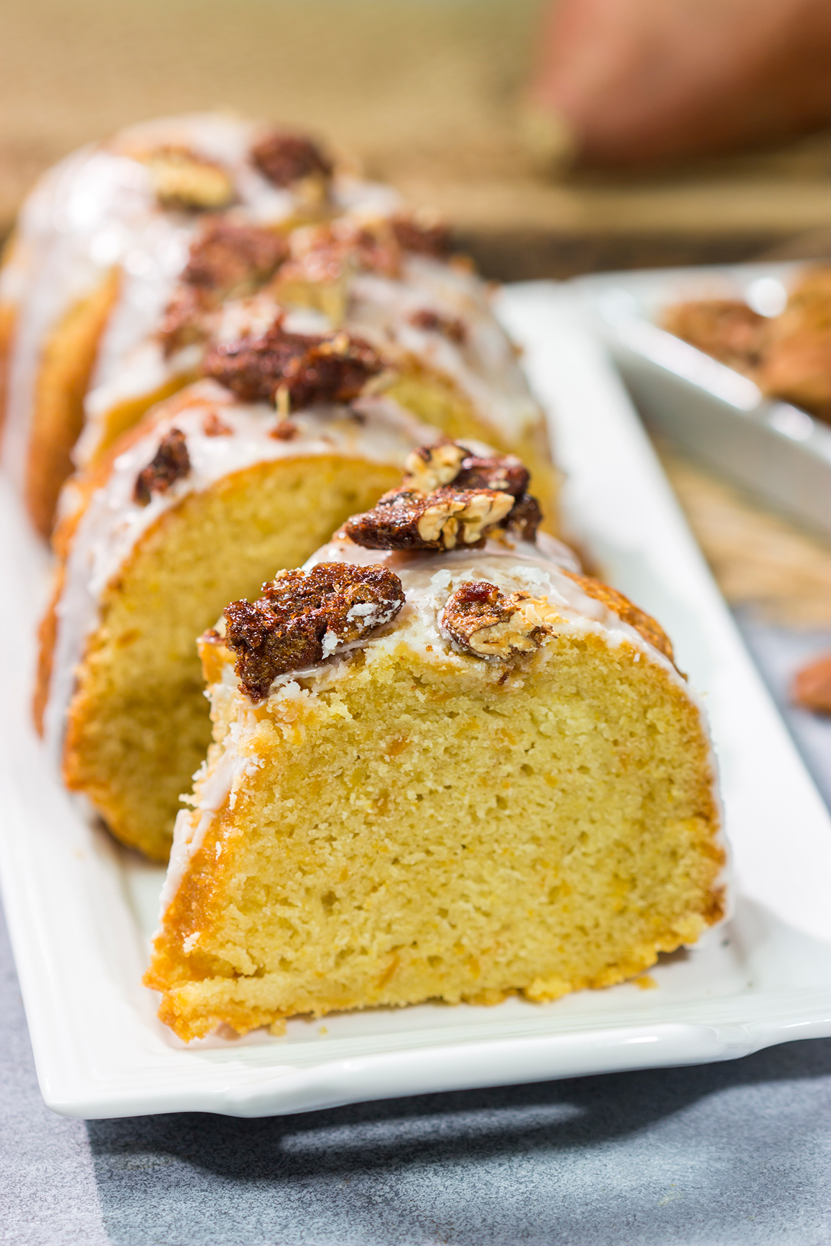 This Sweet Potato Pound Cake is a tender, buttery cake recipe that calls for cinnamon and mashed sweet potatoes. Topped with cinnamon pecans, this cake is the perfect fall dessert!