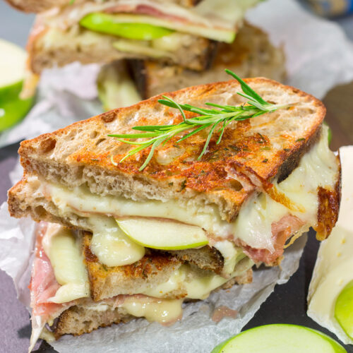 Take your grilled cheese game to the next level with this Prosciutto and Brie Grilled Cheese. Buttery bread, melty cheese and prosciutto combine to create a fantastic toasted sandwich!
