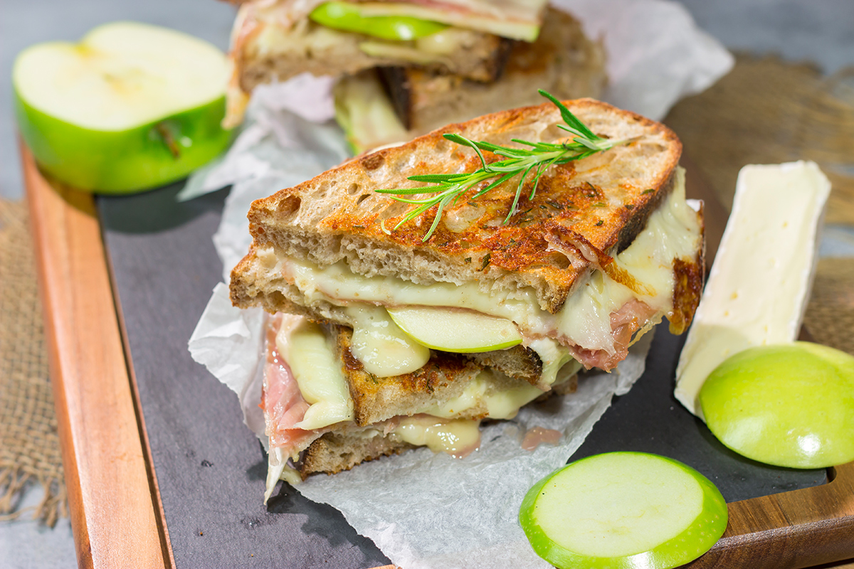 Take your grilled cheese game to the next level with this Prosciutto and Brie Grilled Cheese. Buttery bread, melty cheese and prosciutto combine to create a fantastic toasted sandwich!