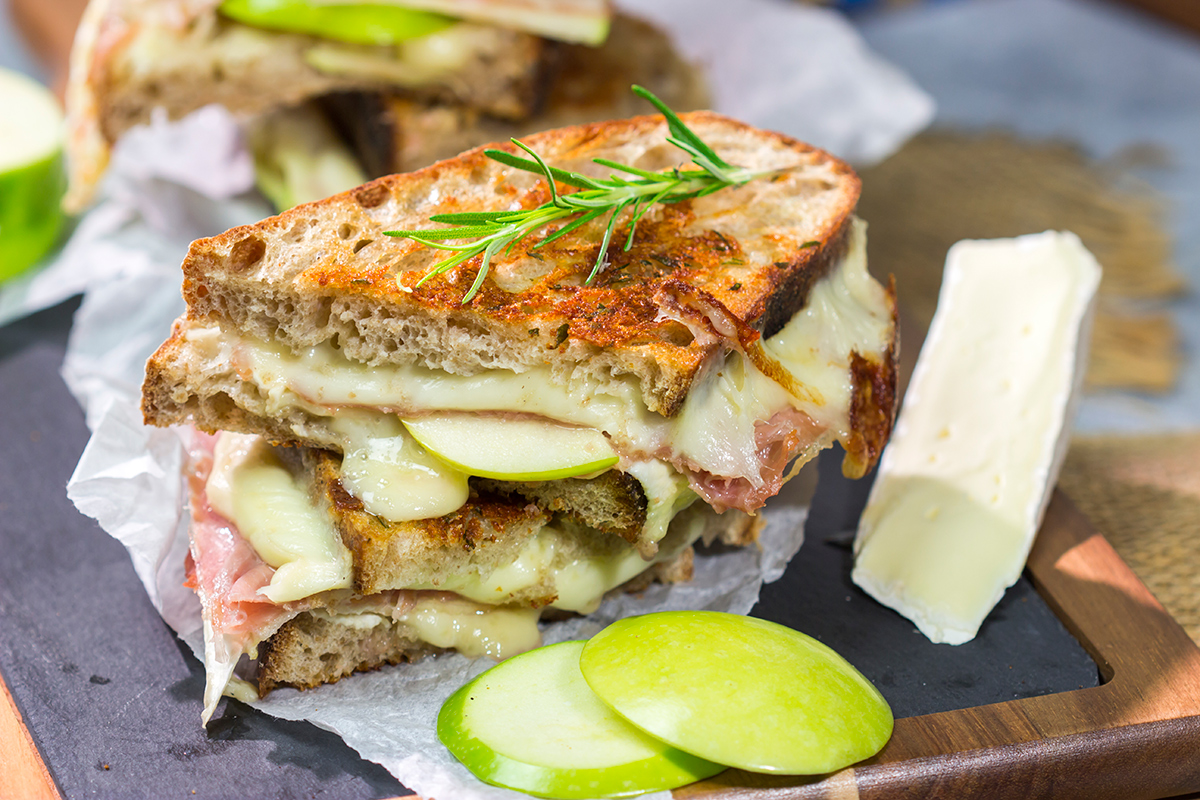 Take your grilled cheese game to the next level with this Prosciutto and Brie Grilled Cheese. Buttery bread, melty cheese and prosciutto combine to create a fantastic toasted sandwich!