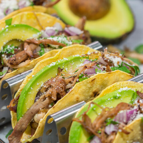 Make it a taco night! These Smoked Pork Tacos feature carnitas-style pork topped with topped with all of your favorite taco toppings. They're perfect for a crowd...or just a Tuesday night!