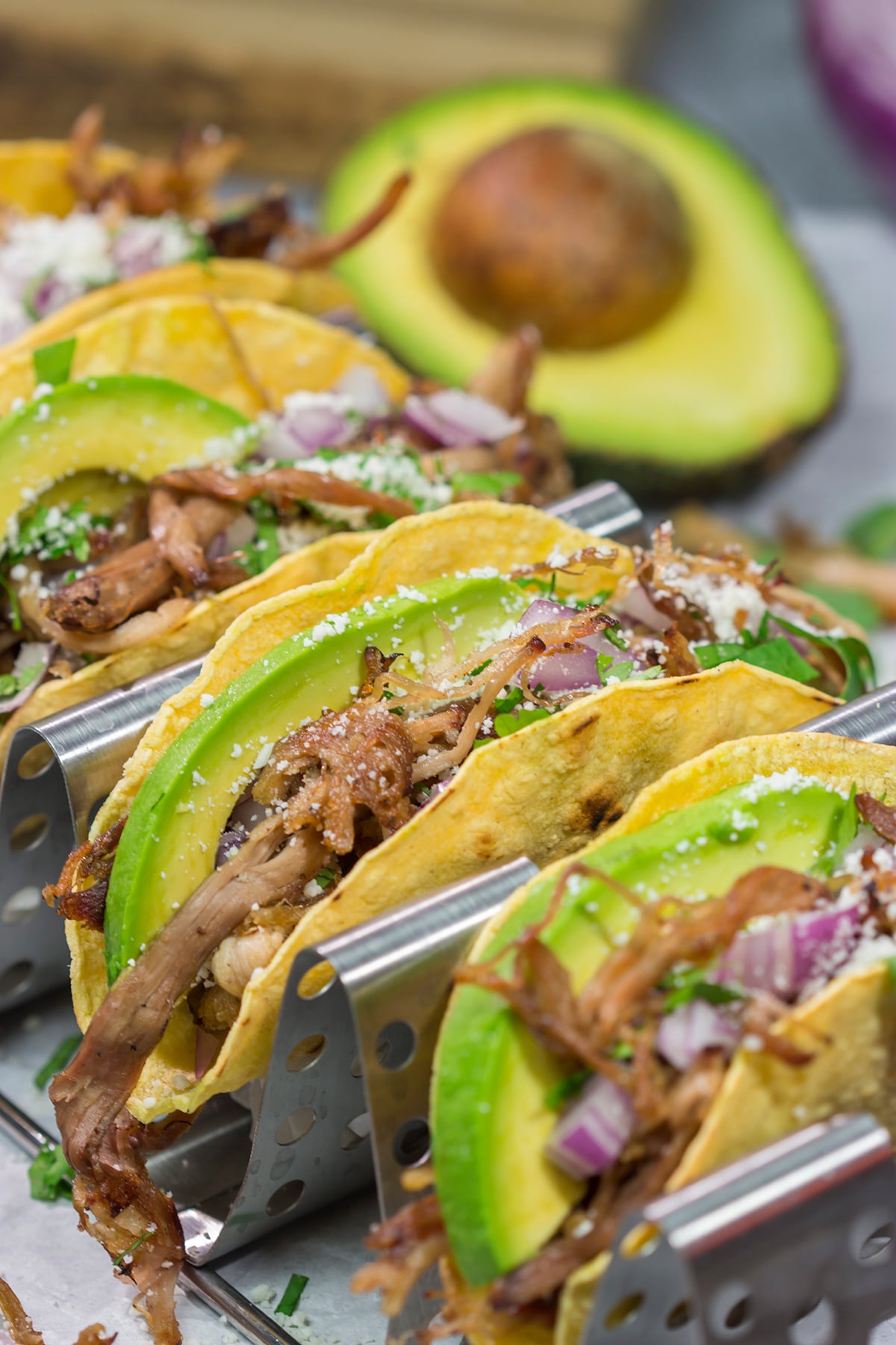 Make it a taco night! These Smoked Pork Tacos feature carnitas-style pork topped with topped with all of your favorite taco toppings. They're perfect for a crowd...or just a Tuesday night!