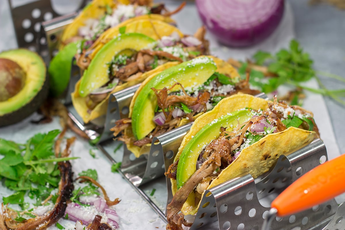 Make it a taco night! These Smoked Pork Tacos feature carnitas-style pork topped with topped with all of your favorite taco toppings. They're perfect for a crowd...or just a Tuesday night!