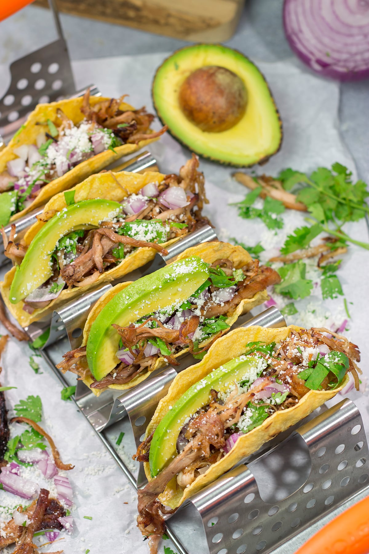 Make it a taco night! These Smoked Pork Tacos feature carnitas-style pork topped with topped with all of your favorite taco toppings. They're perfect for a crowd...or just a Tuesday night!