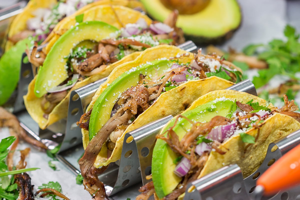 Make it a taco night! These Smoked Pork Tacos feature carnitas-style pork topped with topped with all of your favorite taco toppings. They're perfect for a crowd...or just a Tuesday night!
