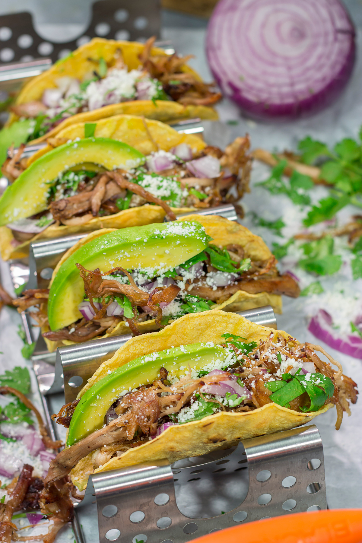 Make it a taco night! These Smoked Pork Tacos feature carnitas-style pork topped with topped with all of your favorite taco toppings. They're perfect for a crowd...or just a Tuesday night!