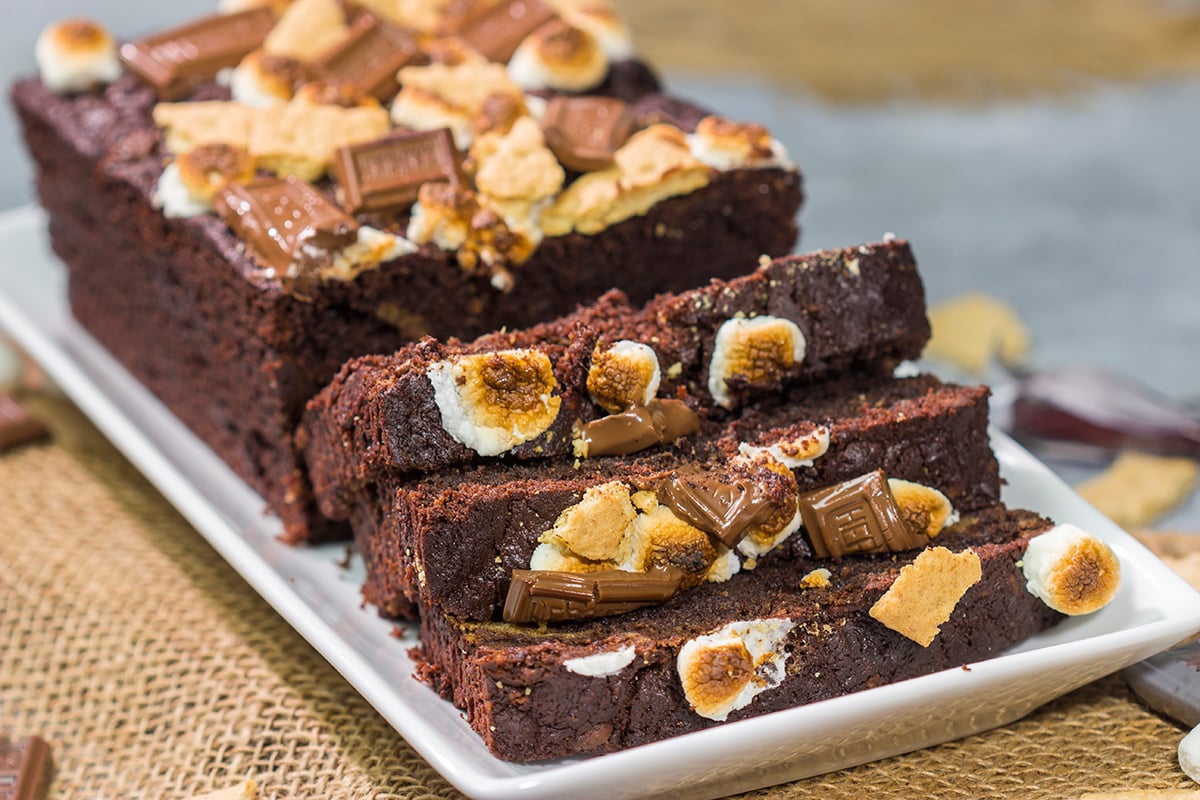 Loaded with chocolate, graham crackers and marshmallows, a slice of this Smores Quick Bread makes for a fantastic snack or dessert!