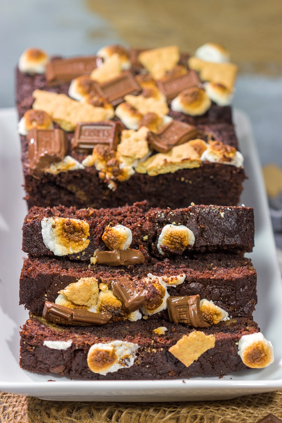 Loaded with chocolate, graham crackers and marshmallows, a slice of this Smores Quick Bread makes for a fantastic snack or dessert!