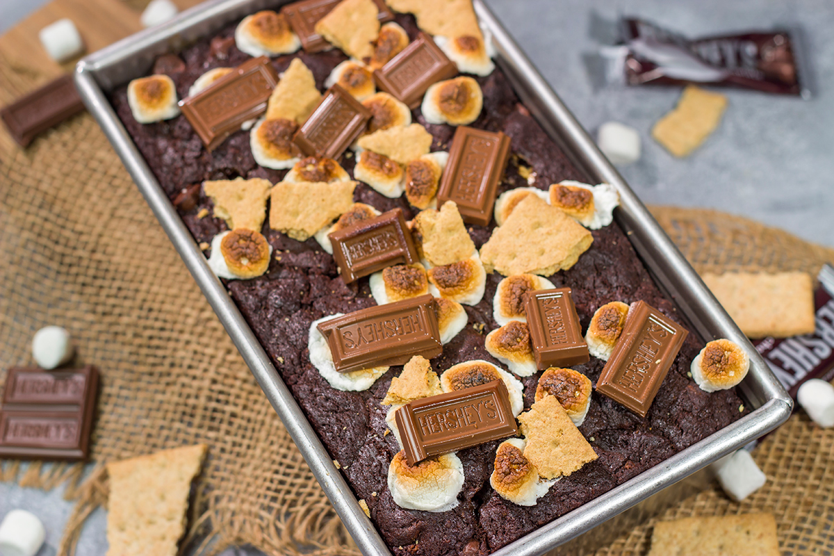 Loaded with chocolate, graham crackers and marshmallows, a slice of this Smores Quick Bread makes for a fantastic snack or dessert!