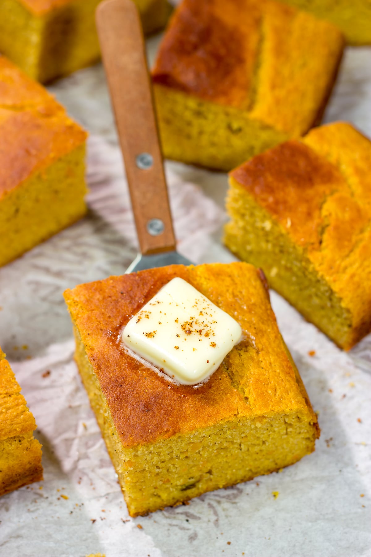 This Sweet Potato Cornbread is the perfect side dish for fall meals. It's a delicious combination of sweet and savory, and it goes well next to barbecue or a hearty bowl of chili!