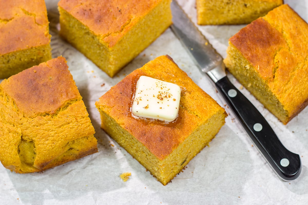 This Sweet Potato Cornbread is the perfect side dish for fall meals. It's a delicious combination of sweet and savory, and it goes well next to barbecue or a hearty bowl of chili!