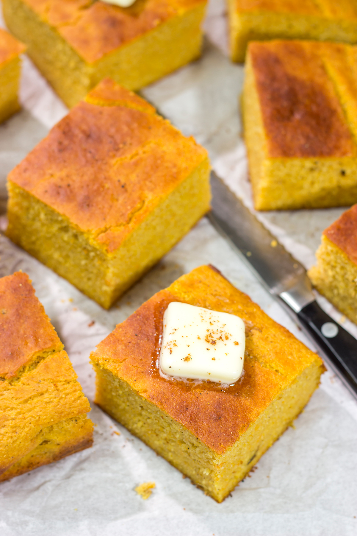 This Sweet Potato Cornbread is the perfect side dish for fall meals. It's a delicious combination of sweet and savory, and it goes well next to barbecue or a hearty bowl of chili!