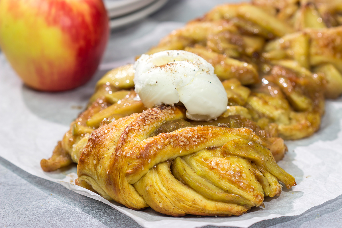 Put a twist (literally!) on a classic with this Braided Apple Pie. Apples seasoned with cinnamon and brown sugar wrapped in buttery pie dough - it's the perfect fall dessert!