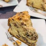 This Chocolate Chip Coffee Cake is soft and tender, and it's topped with an amazing brown sugar + cinnamon streusel. Oh, and it's packed with chocolate chips, too!