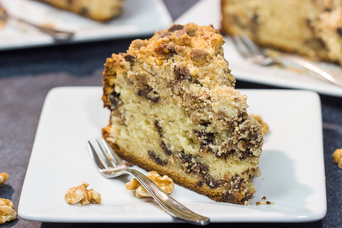 This Chocolate Chip Coffee Cake is soft and tender, and it's topped with an amazing brown sugar + cinnamon streusel. Oh, and it's packed with chocolate chips, too!