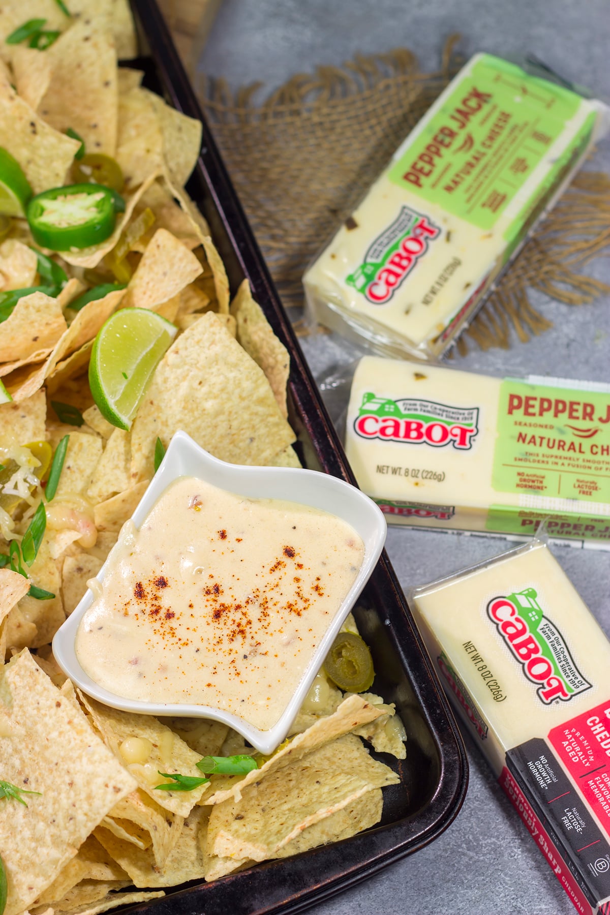 Put a tasty spin on nachos with a batch of this homemade Pepper Jack Nacho Cheese Sauce! This recipe is great for a football appetizer or a game night with friends.