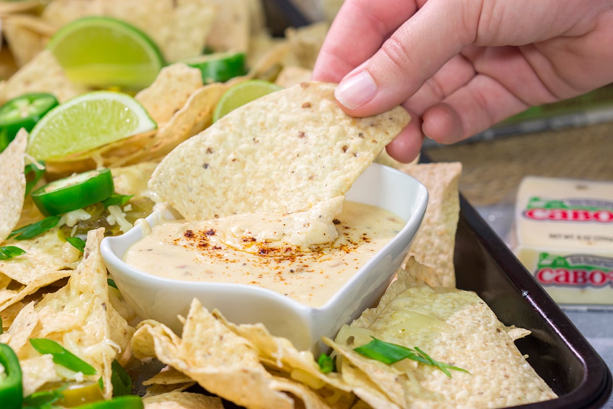 Put a tasty spin on nachos with a batch of this homemade Pepper Jack Nacho Cheese Sauce! This recipe is great for a football appetizer or a game night with friends.