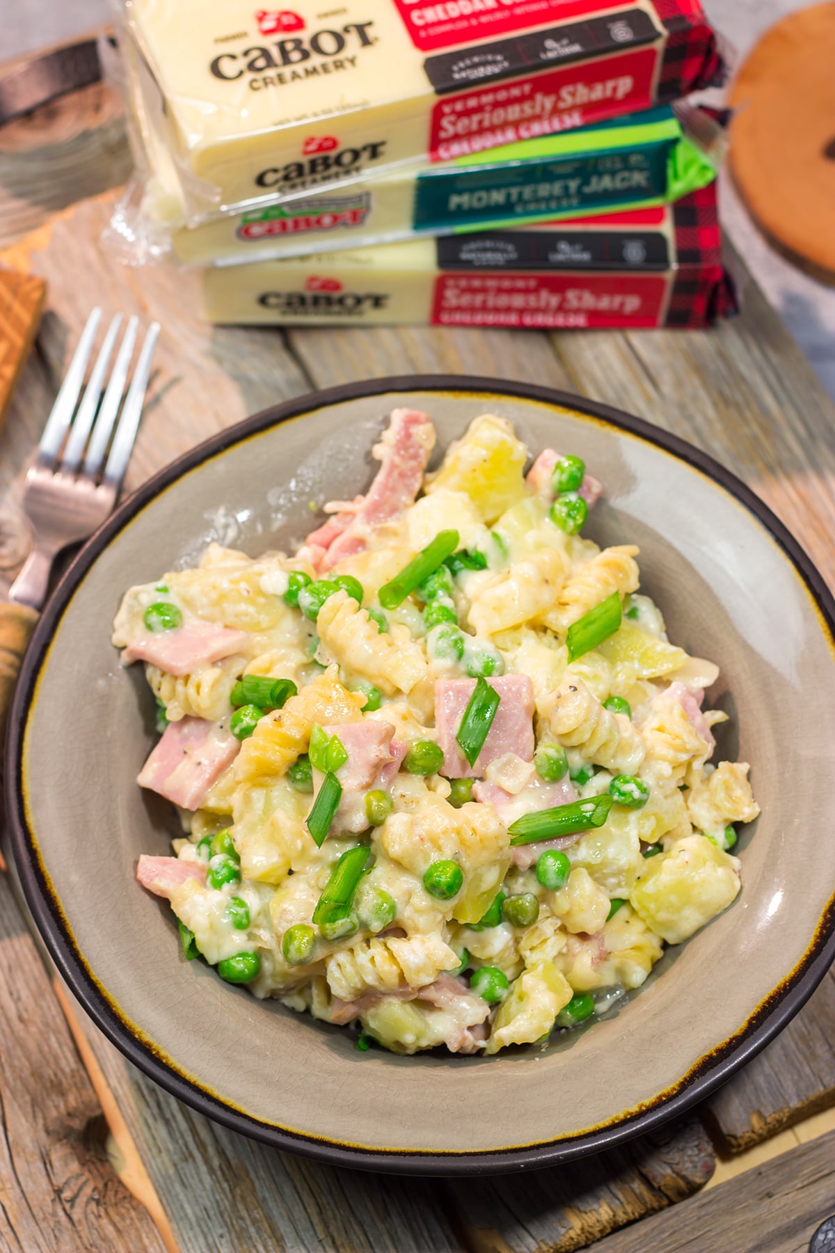 This Cheesy Ham and Potato Casserole makes for a great weeknight meal or potluck dish. The smoked ham, potatoes and cheesy cream sauce combine to create delicious cold-weather comfort food!