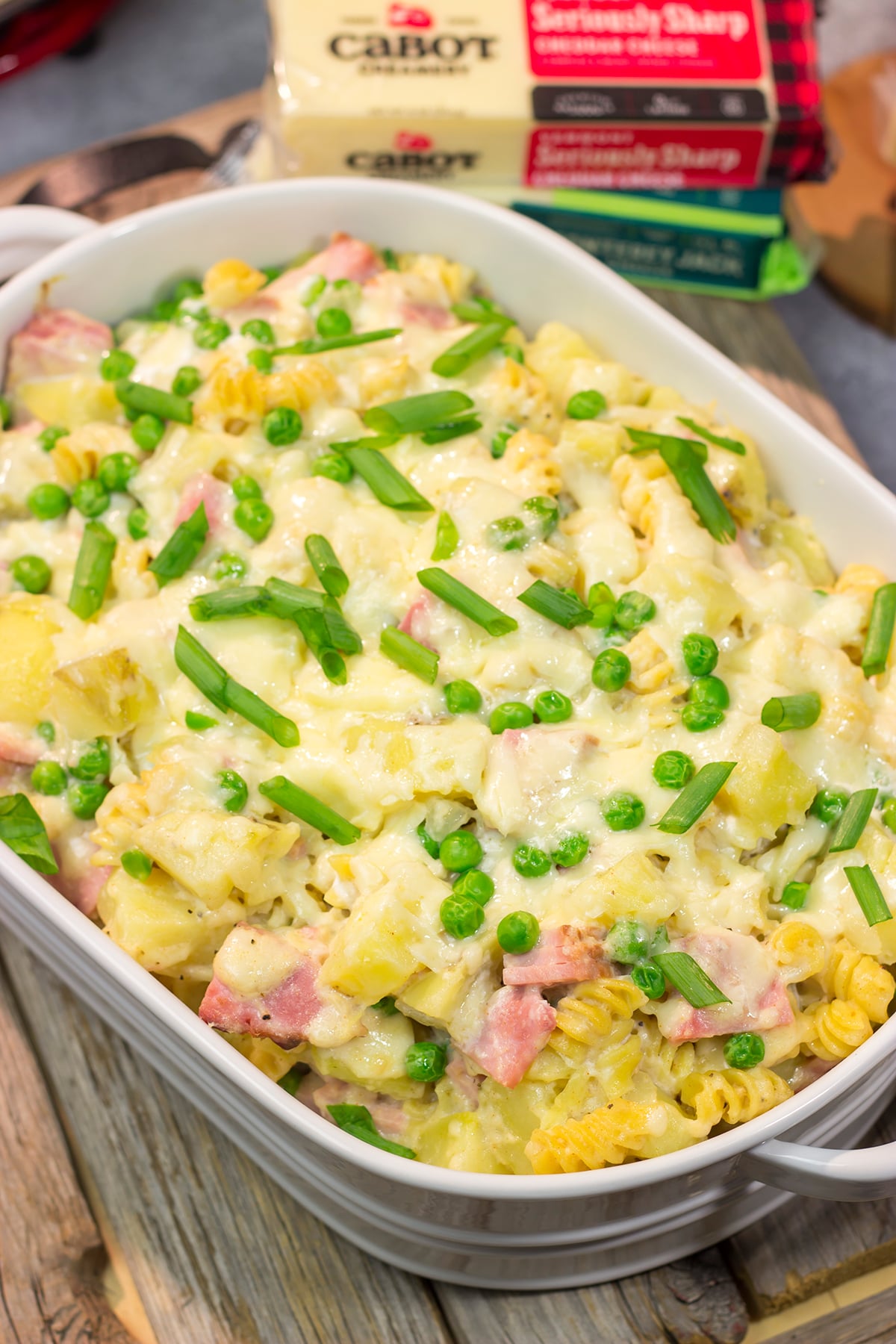 This Cheesy Ham and Potato Casserole makes for a great weeknight meal or potluck dish. The smoked ham, potatoes and cheesy cream sauce combine to create delicious cold-weather comfort food!