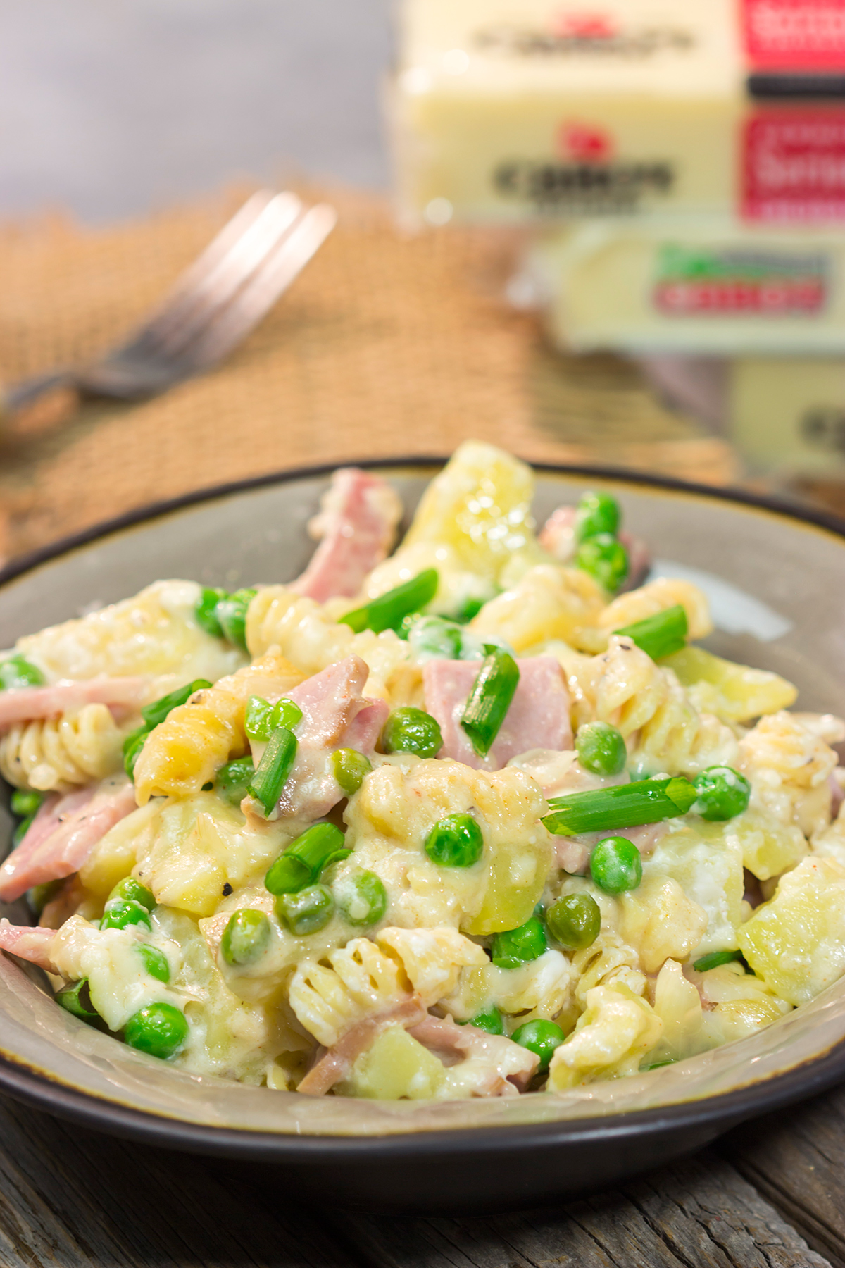 This Cheesy Ham and Potato Casserole makes for a great weeknight meal or potluck dish. The smoked ham, potatoes and cheesy cream sauce combine to create delicious cold-weather comfort food!