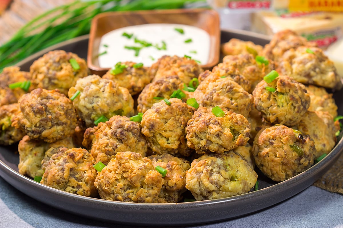 These Cheesy Sausage Balls are perfect for holiday appetizer parties and get-togethers with friends. They're easy to make...and even easier to eat!
