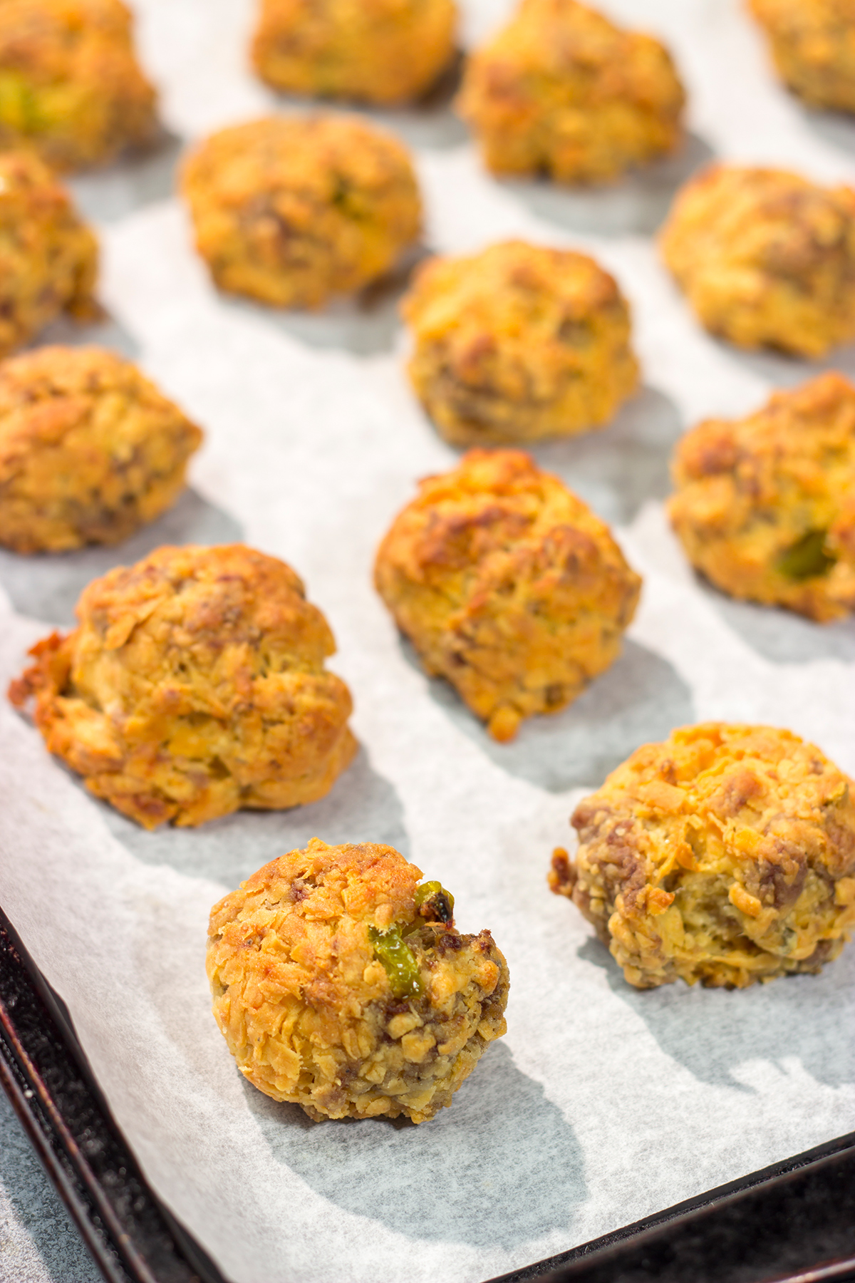 These Cheesy Sausage Balls are perfect for holiday appetizer parties and get-togethers with friends. They're easy to make...and even easier to eat!