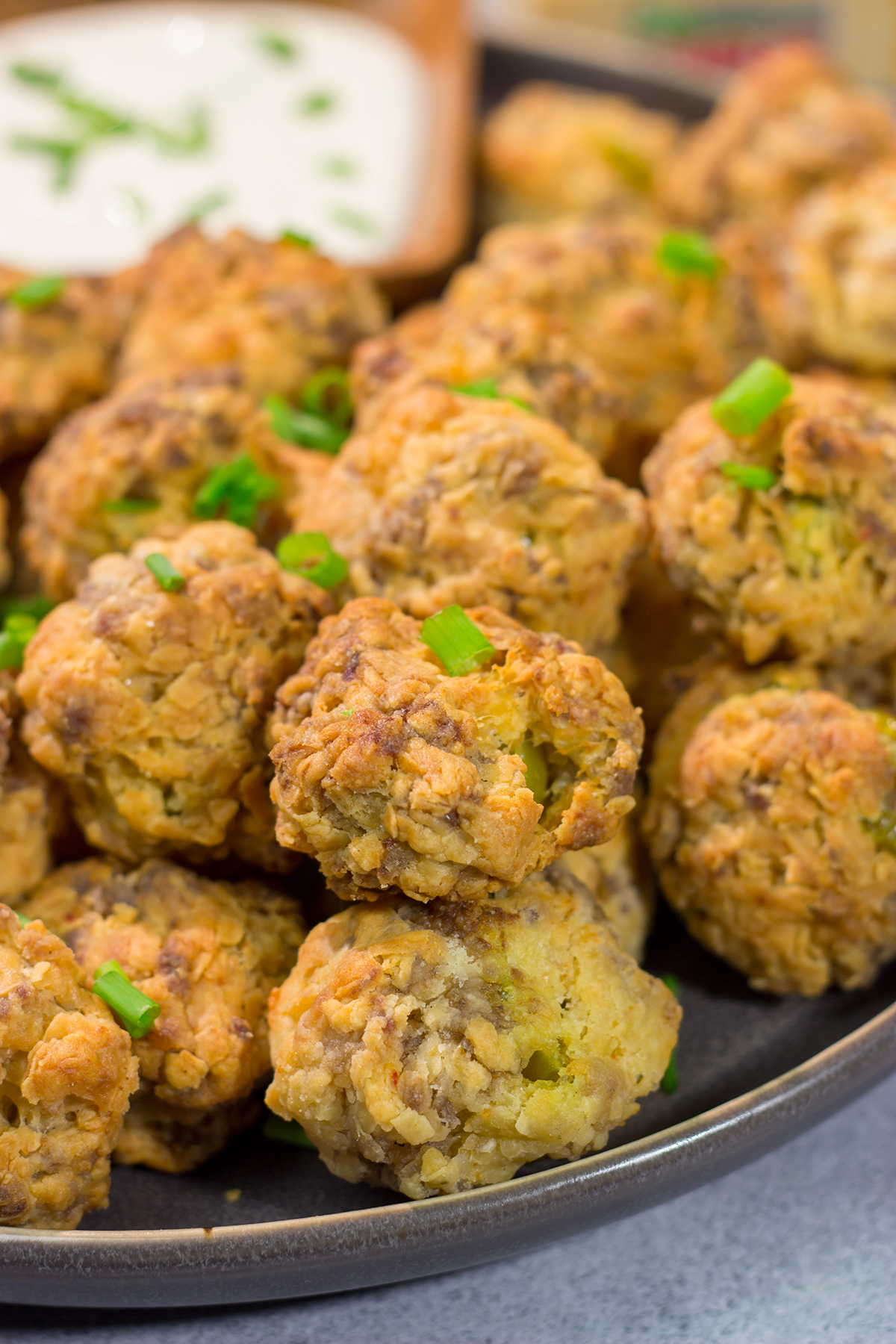 These Cheesy Sausage Balls are perfect for holiday appetizer parties and get-togethers with friends. They're easy to make...and even easier to eat!