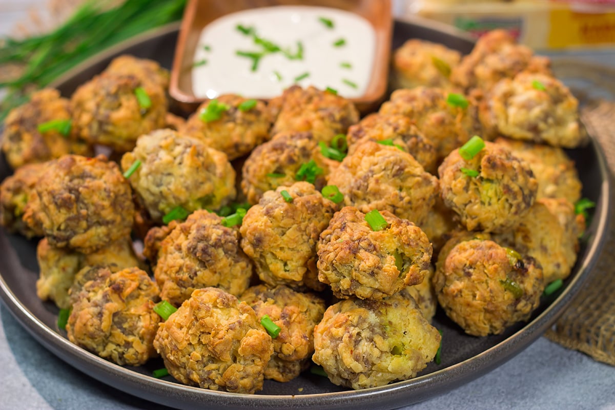 These Cheesy Sausage Balls are perfect for holiday appetizer parties and get-togethers with friends. They're easy to make...and even easier to eat!