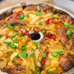 This savory Chicken Fajita Monkey Bread includes a combination of biscuits, juicy chicken, onions, peppers and cheese. It makes for a fantastic gameday snack!
