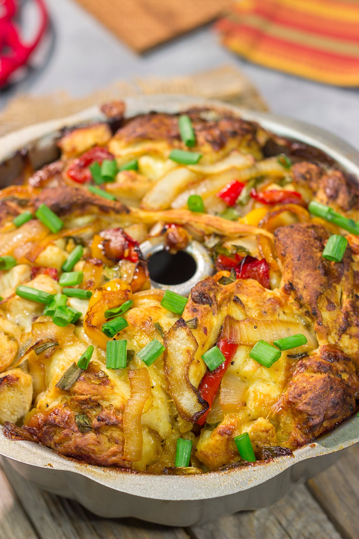 This savory Chicken Fajita Monkey Bread includes a combination of biscuits, juicy chicken, onions, peppers and cheese. It makes for a fantastic gameday snack!