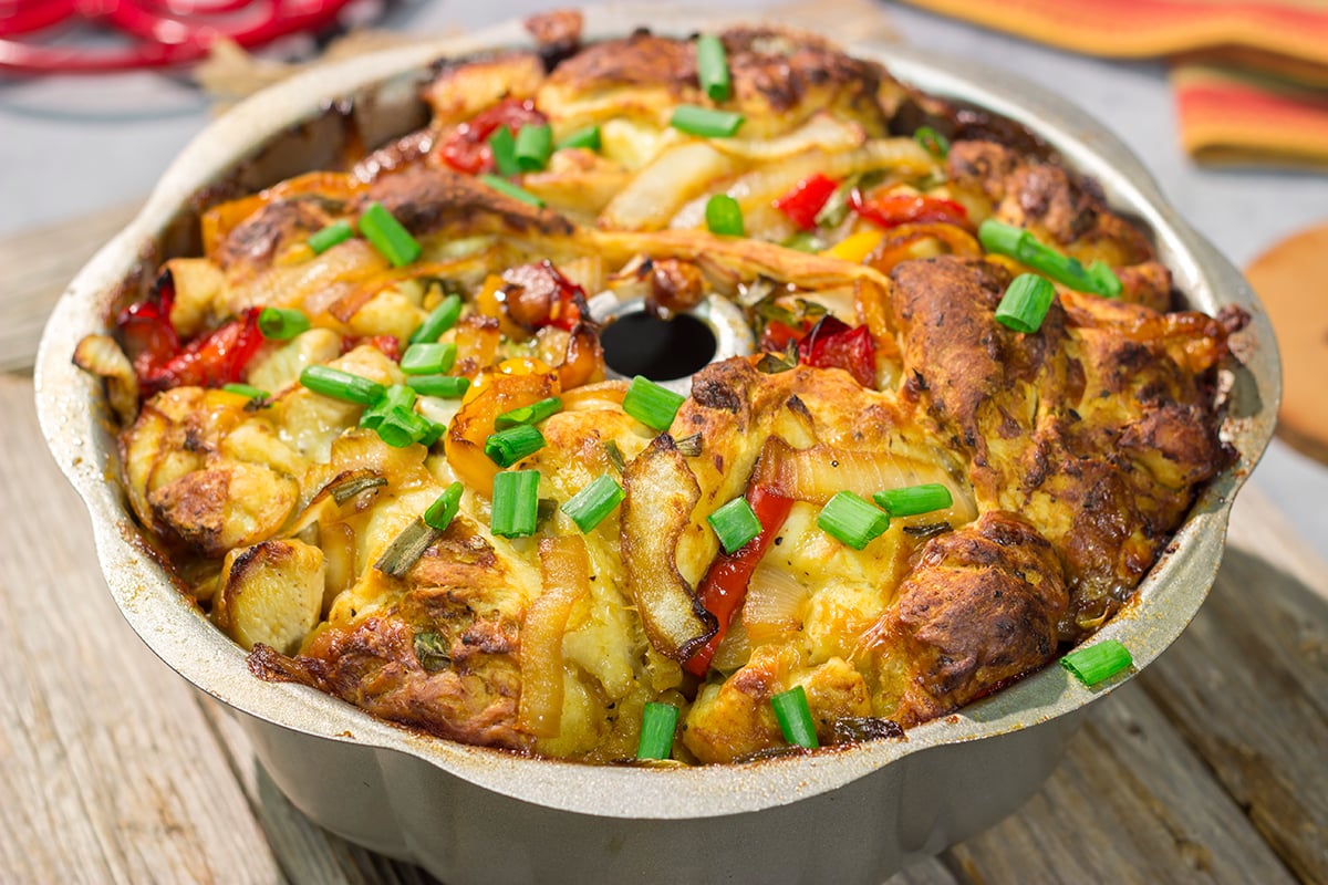 This savory Chicken Fajita Monkey Bread includes a combination of biscuits, juicy chicken, onions, peppers and cheese. It makes for a fantastic gameday snack!
