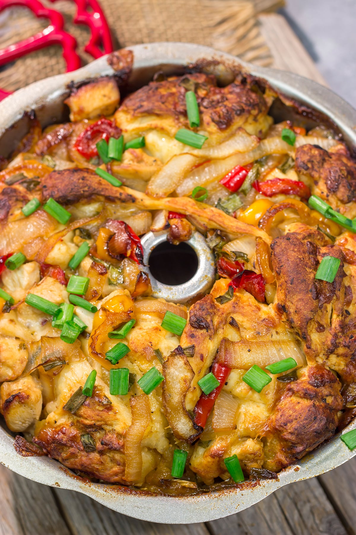 This savory Chicken Fajita Monkey Bread includes a combination of biscuits, juicy chicken, onions, peppers and cheese. It makes for a fantastic gameday snack!