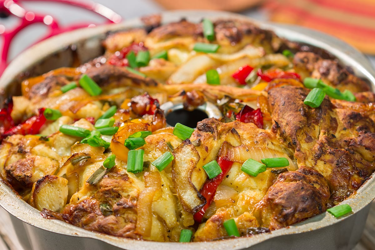 This savory Chicken Fajita Monkey Bread includes a combination of biscuits, juicy chicken, onions, peppers and cheese. It makes for a fantastic gameday snack!