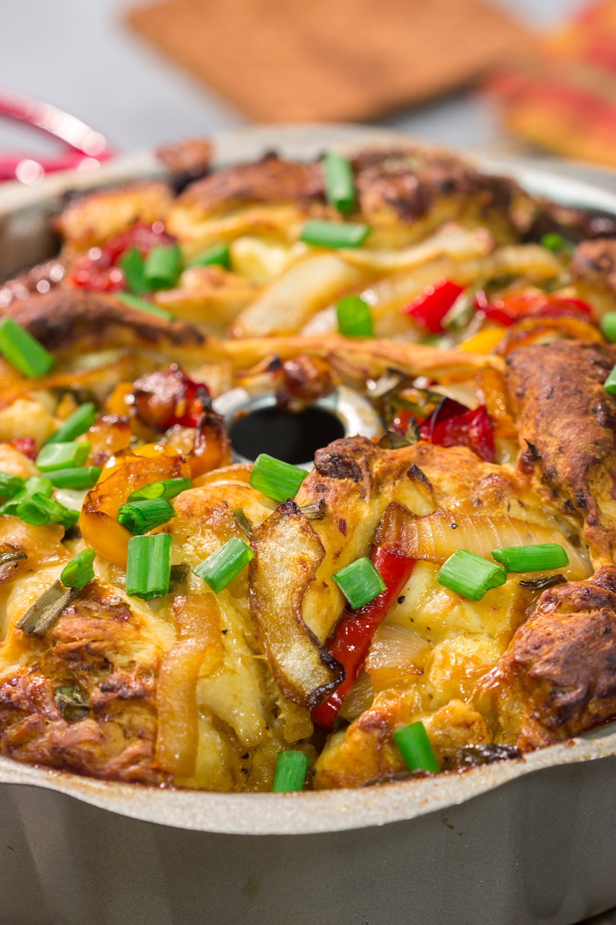 This savory Chicken Fajita Monkey Bread includes a combination of biscuits, juicy chicken, onions, peppers and cheese. It makes for a fantastic gameday snack!