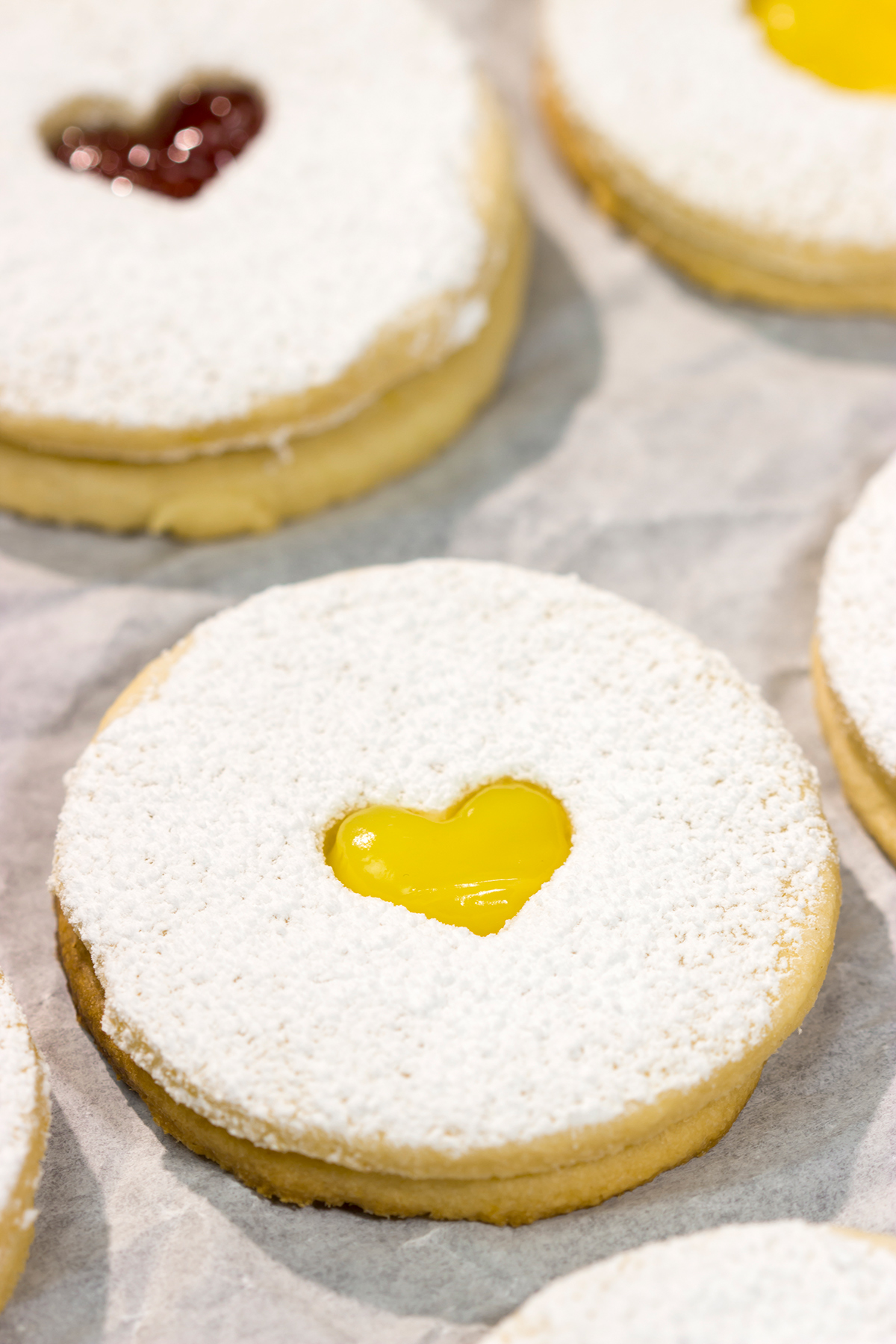 Linzer Cookies are soft, buttery cookies that are traditionally filled with various fruit jams. They are an easy but impressive cookie to make at home!