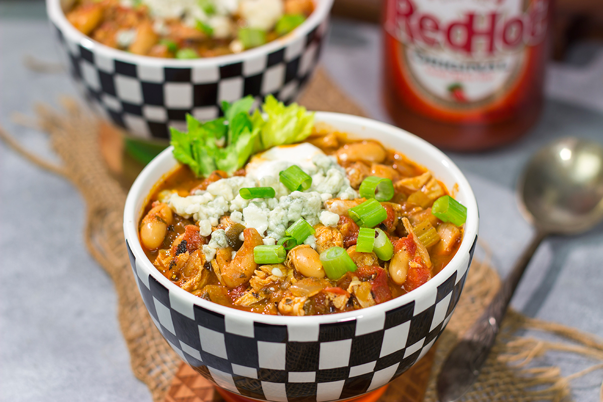 Combine two gameday favorites into one with this Buffalo Chicken Chili. This easy recipe is creamy, spicy...and absolutely delicious!