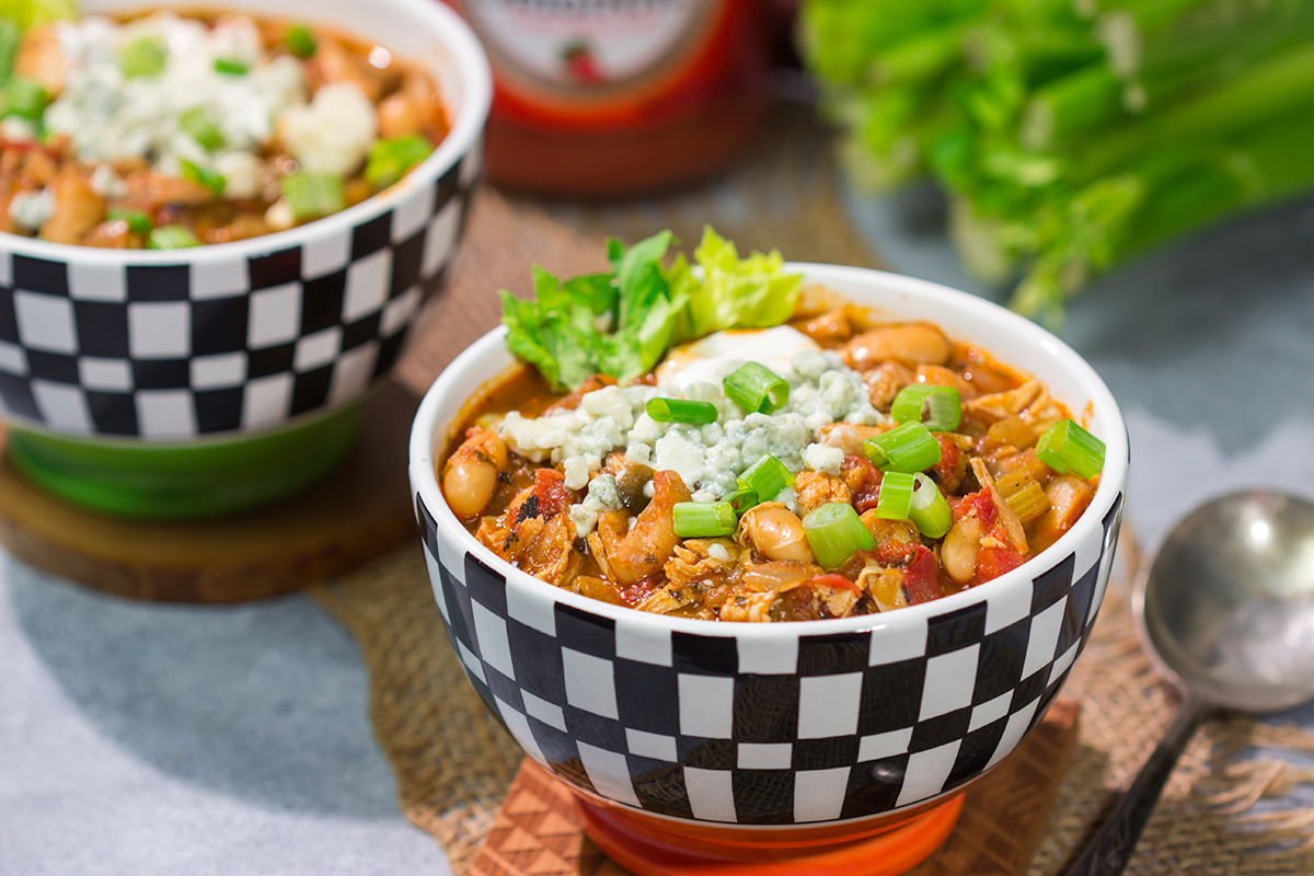 Combine two gameday favorites into one with this Buffalo Chicken Chili. This easy recipe is creamy, spicy...and absolutely delicious!