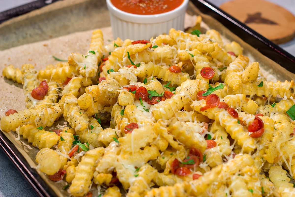 Take game day snacks to a new level! These easy Pepperoni Pizza Fries are loaded with melty cheesy and pepperoni. Leftovers won't be a problem.