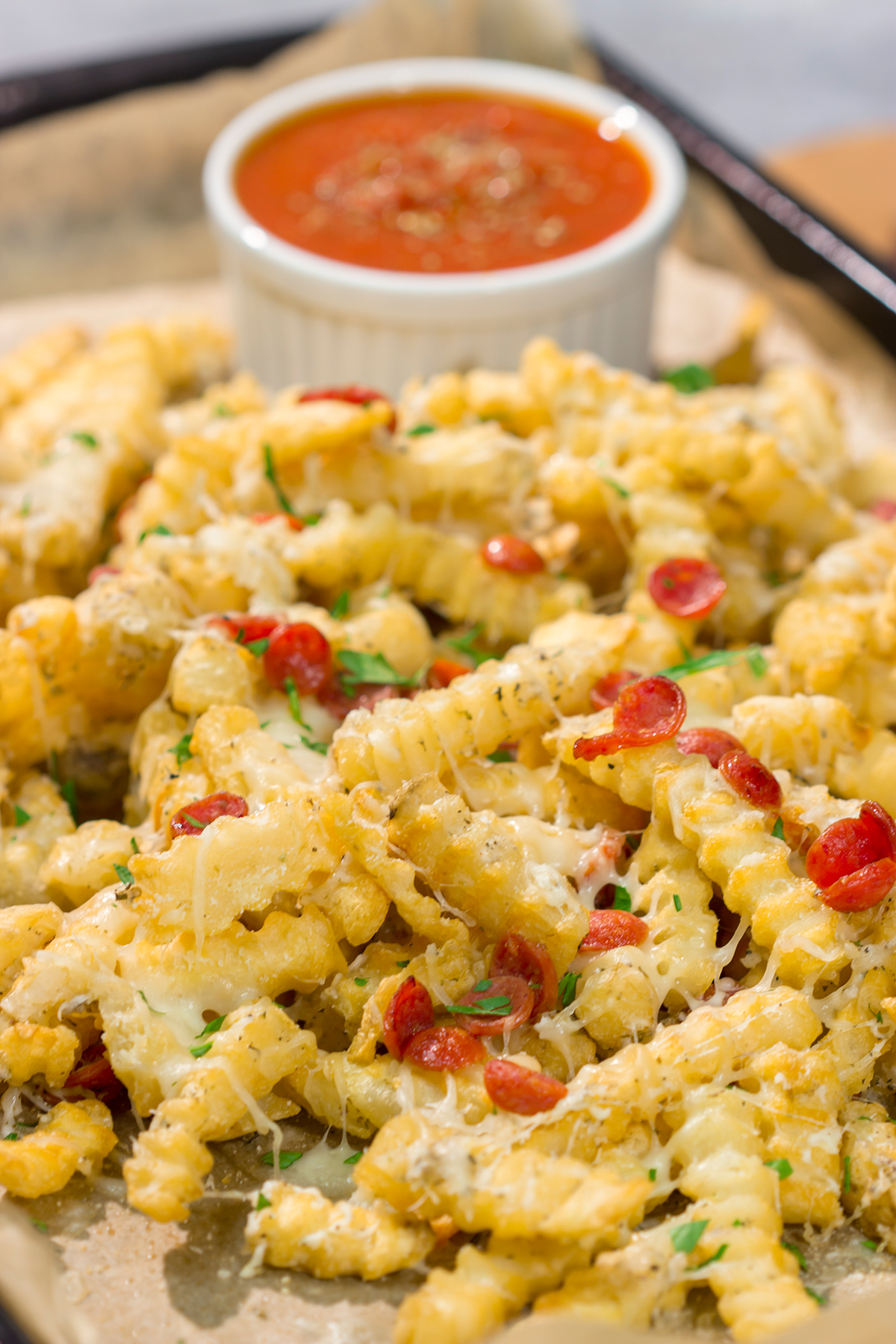 Take game day snacks to a new level! These easy Pepperoni Pizza Fries are loaded with melty cheesy and pepperoni. Leftovers won't be a problem.