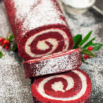 This festive Red Velvet Cake Roll is filled with a classic cream cheese frosting. The soft and chocolatey cake combined with the creamy frosting is delicious!
