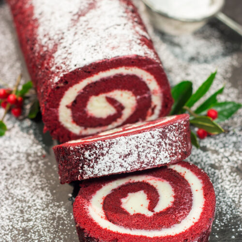 This festive Red Velvet Cake Roll is filled with a classic cream cheese frosting. The soft and chocolatey cake combined with the creamy frosting is delicious!