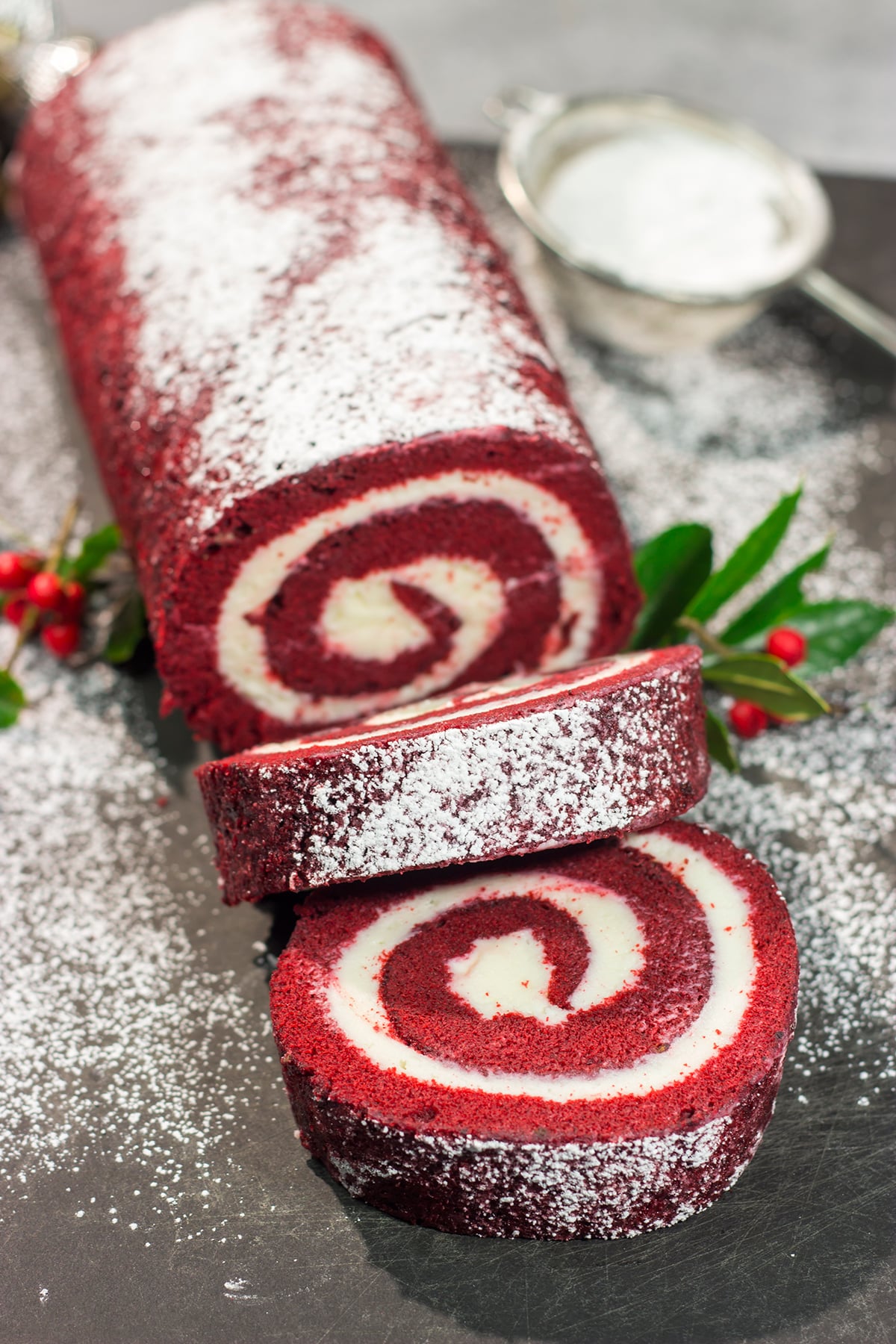 This festive Red Velvet Cake Roll is filled with a classic cream cheese frosting. The soft and chocolatey cake combined with the creamy frosting is delicious!