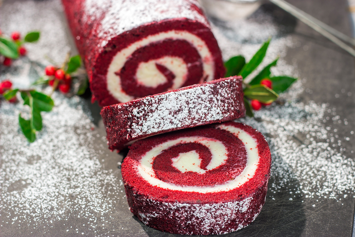 This festive Red Velvet Cake Roll is filled with a classic cream cheese frosting. The soft and chocolatey cake combined with the creamy frosting is delicious!