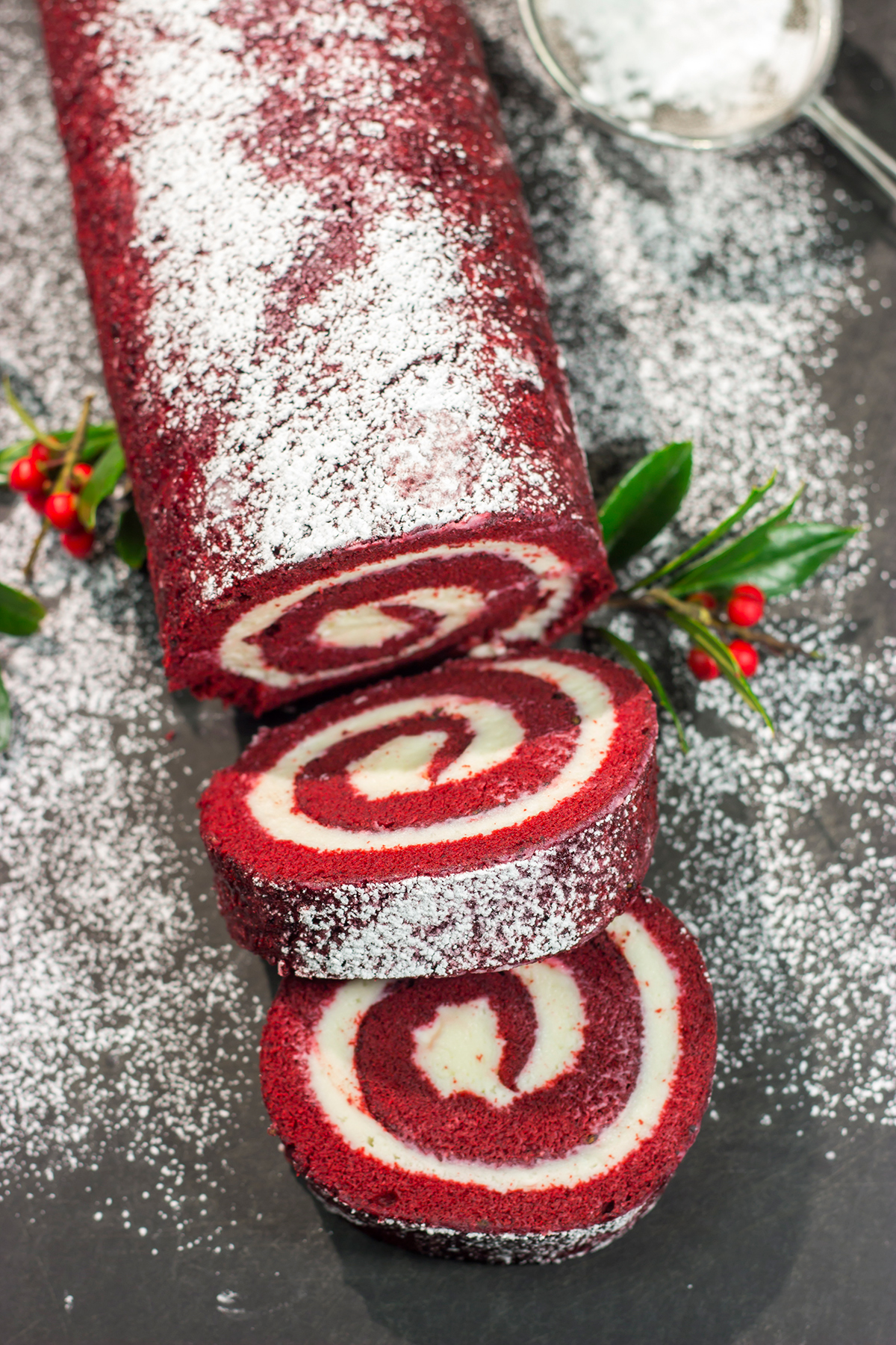 This festive Red Velvet Cake Roll is filled with a classic cream cheese frosting. The soft and chocolatey cake combined with the creamy frosting is delicious!